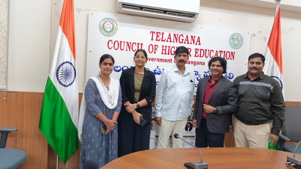 Team members beside the national flag at the Telangana Council of Higher Education