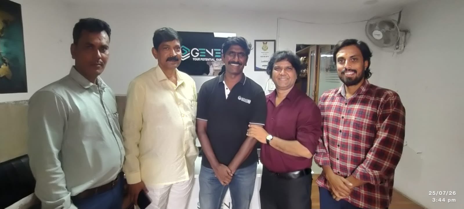 Five members of the team at an office visit